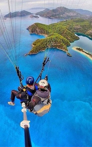 Talk about a bird's eye view! If you've never been parasailing over a pristine island, looking at this #Selfie is probably the next best thing_ #SelfieSticks